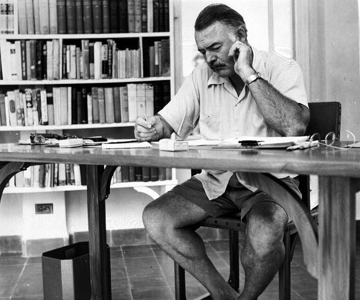 Ernest Hemingway at his desk in Key West
